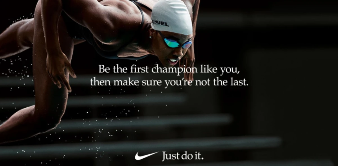 Nikes "Just Do It" campaign. A professional swimmer wearing googles and a cap, text says "Be the first champion like you, then make sure you're not the last."